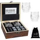 Granite whiskey chilling rocks set in wooden box with two faceted glasses and cubes