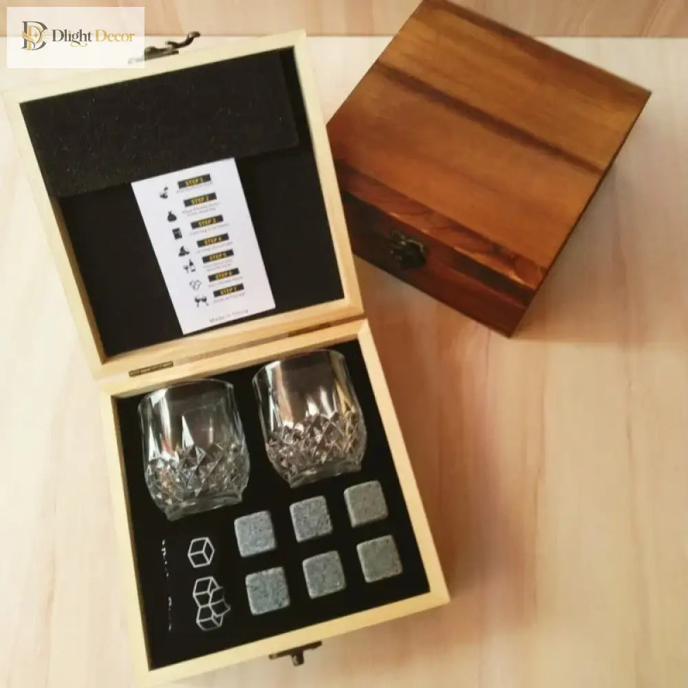 Granite chilling rocks and two whiskey glasses in open wooden storage box