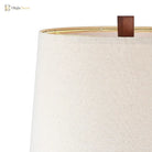 Beige fabric lampshade with dark wood finial and inner socket detail