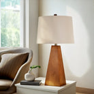 Wooden LED desk lamp with beige fabric shade and tapered brown wood base